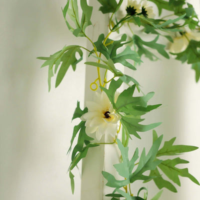 Artificial flower garland with green leaves and white blooms for decor
