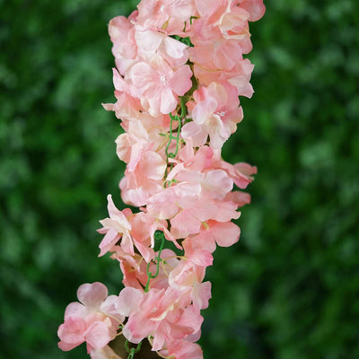 Pink flower vine decoration for home or event styling.