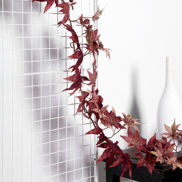 Enhance Your Space with the Burgundy Artificial Silk Maple Leaf Hanging Fall Garland Vine