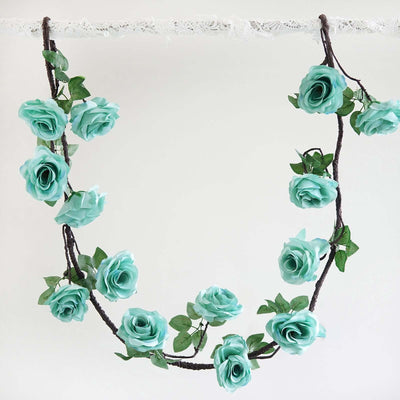 Mint green artificial rose garland on a white background