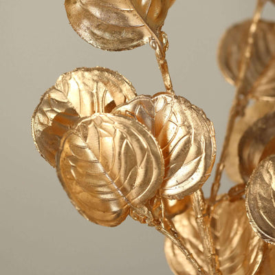 Gold leaf decorative branch with intricate details.