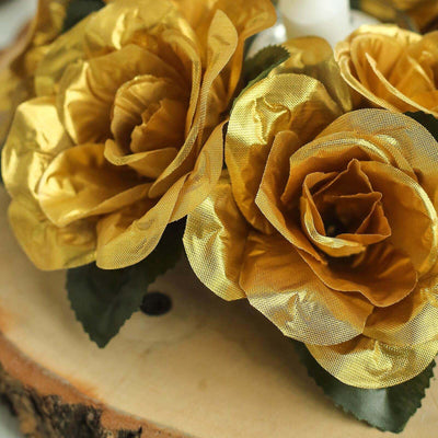 Gold fabric roses arranged on a wooden base.