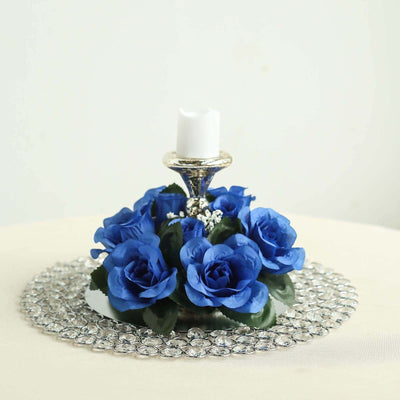Blue rose candle holder centerpiece with silver accents.