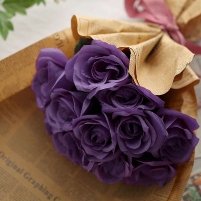 Purple rose bouquet wrapped in decorative paper.