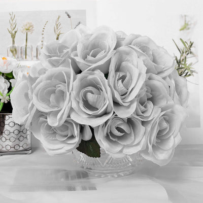 White artificial rose bouquet in a crystal vase.
