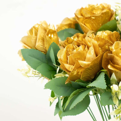 Golden artificial roses bouquet with green leaves