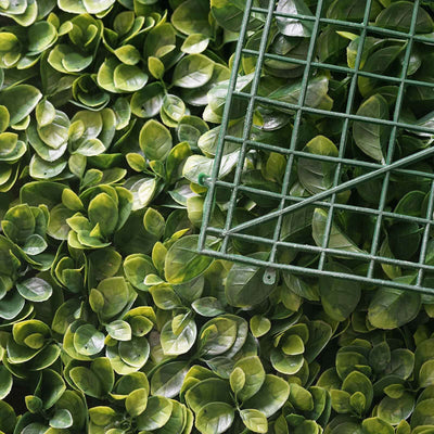 Artificial boxwood hedge panel with grid backing for landscaping or decor.