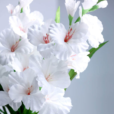 White artificial flowers in a bouquet arrangement.