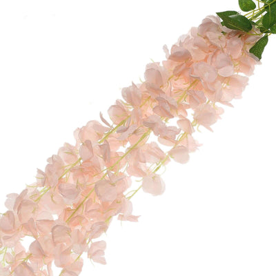 Artificial pink flower garland on a white background