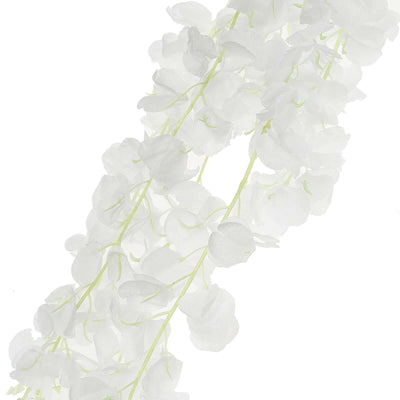 White artificial flower garland on a plain background