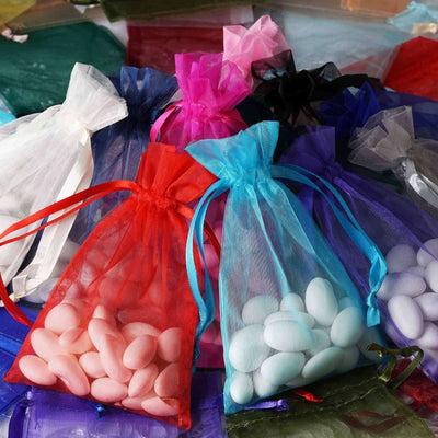 Colorful organza bags filled with decorative candies.