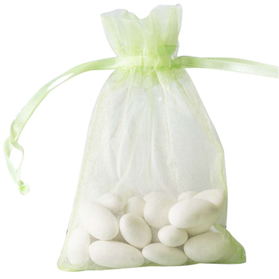 White candy-coated almonds in a sheer green organza bag.