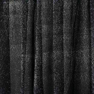 Black glitter fabric with shimmering texture and folds.