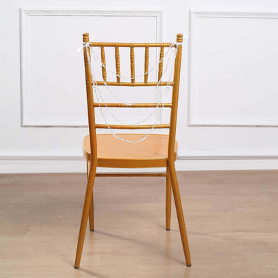 Gold chiavari chair with decorative chain draped over the back.