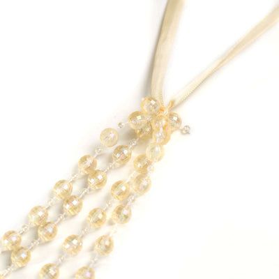 Elegant crystal bead necklace with satin ribbon.