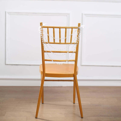 Gold Chiavari chair adorned with decorative beads.