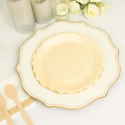 Elegant scalloped edge plate on a beautifully arranged table setting.