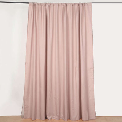 Pink curtain draped elegantly on a rod, showcasing its smooth fabric texture.