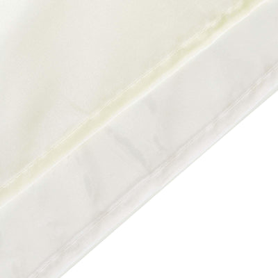 Close-up of silky fabric texture in cream color.