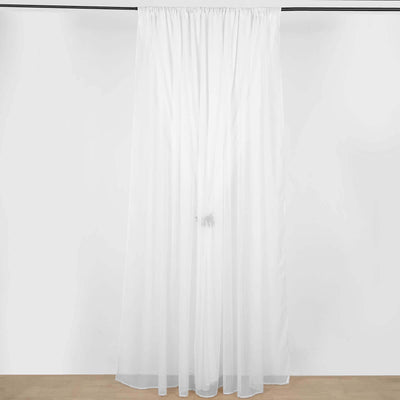 Sheer white curtain hanging from a rod against a plain background