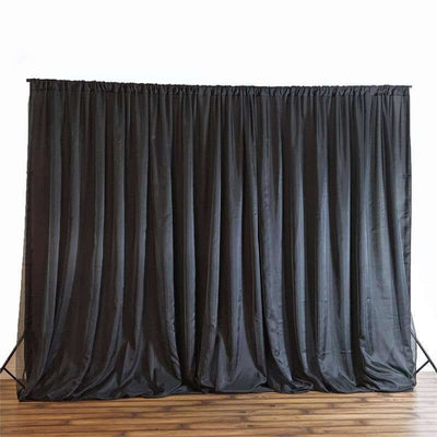 Black backdrop curtain draped for photography or event staging