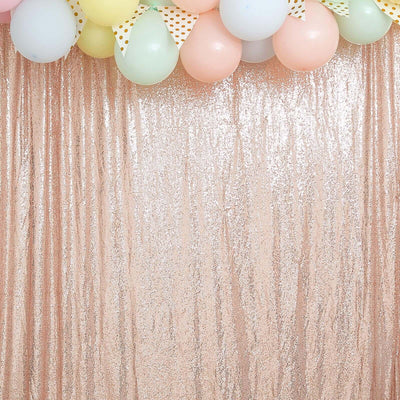 Sequin backdrop with pastel balloons for festive celebrations.