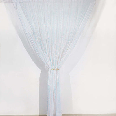 Sheer white sequin curtain draped elegantly, adding sparkle to any space.