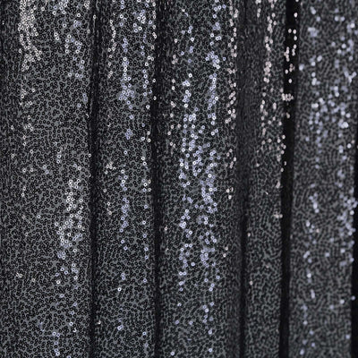Black sequin fabric with shimmering texture and detail.
