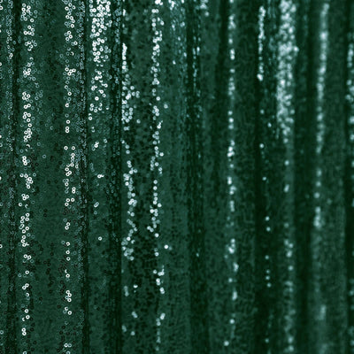 Green sequin fabric with shimmering texture and glossy finish.