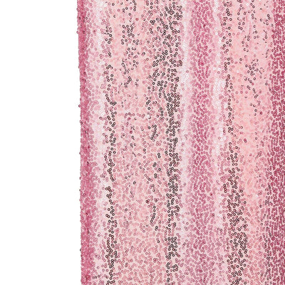 Pink sequin fabric with a shimmering texture and varying shades.