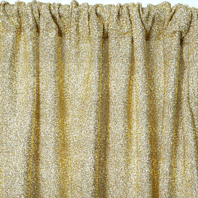 Gold glitter curtain fabric with shimmering texture.