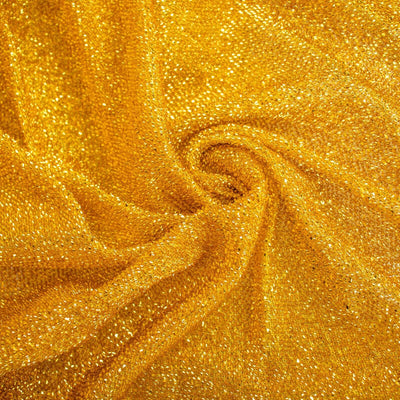 Gold shimmering fabric with sparkling texture.