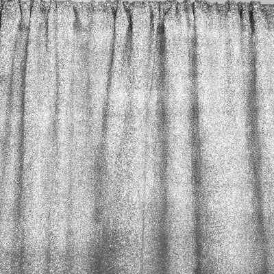 Silver glitter curtain with a shimmering texture.