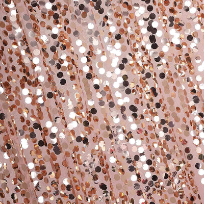 Rose gold sequin fabric with shimmering circular sequins.