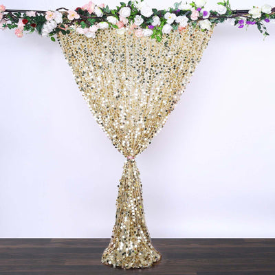 Gold sequin curtain draped elegantly with floral accents.