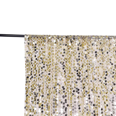 Gold and silver sequin curtain panel on a rod