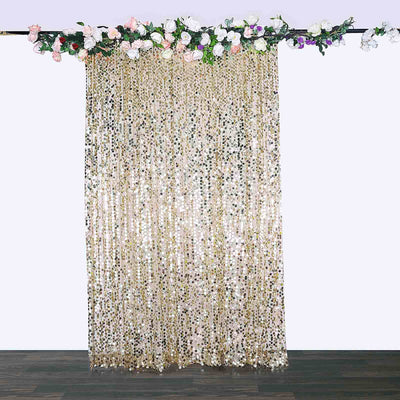 Gold sequin backdrop curtain with floral accents for event decoration.