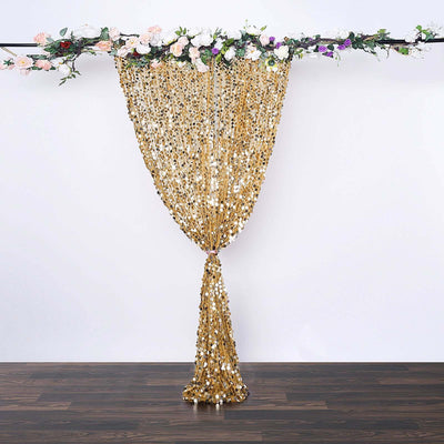 Gold sequin curtain with floral accents, ideal for events and photo backdrops.