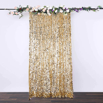 Gold sequin backdrop with floral accents for events and photo booths.