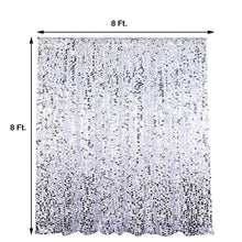 A picture of a silver sequined curtain with measurements
