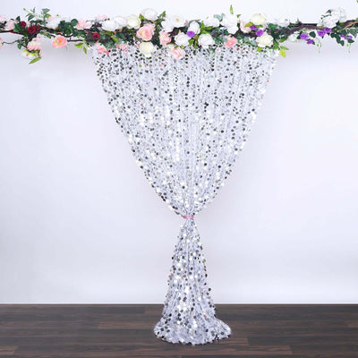 Silver sequin curtain with floral top, ideal for events and decorations.