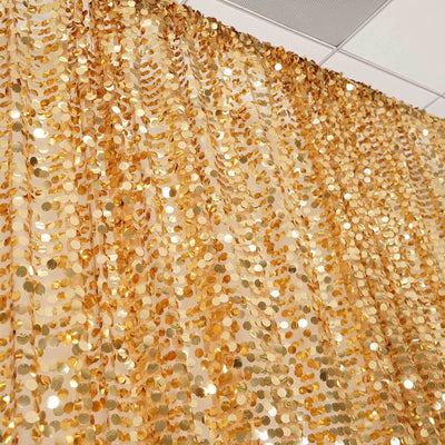 Gold sequin curtain for party decoration or backdrop.