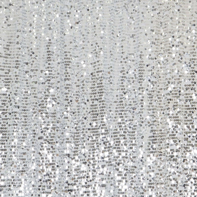 Silver sequin fabric with shimmering texture and reflective surface.