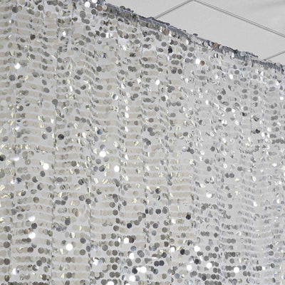 Shiny silver sequin curtain with a shimmering effect.