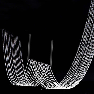 Elegant crystal chandelier with cascading strands of light.