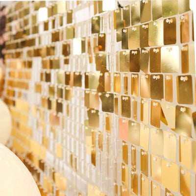 Colorful gold paint sample swatches arranged in a decorative wall display.