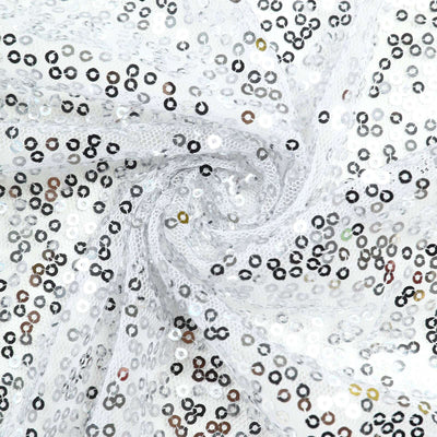 White sequin fabric with a spiral pattern.
