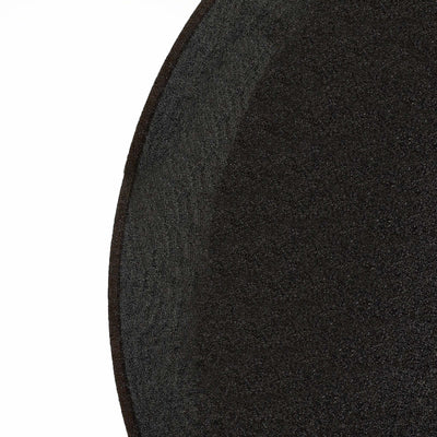 Black textured circular mat on a plain white background.