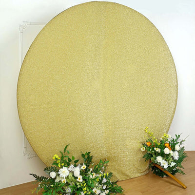 Gold glitter backdrop with floral arrangements for events or photography.