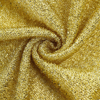 Gold shimmering fabric with intricate texture details.